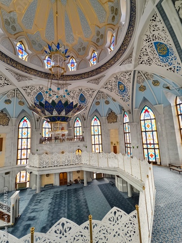 Kazan Kremlin, Kazan, Russia, July 26,2024: Kul Sharif Mosque, the main prayer hall with its huge blue-and-gold chandelier, Islamic geometric patterns, and stained-glass windows.