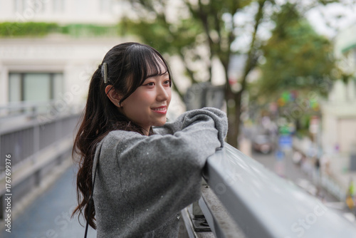 Smiling young woman in side view close-up