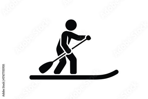 Silhouette of a person paddleboarding on a calm body of water