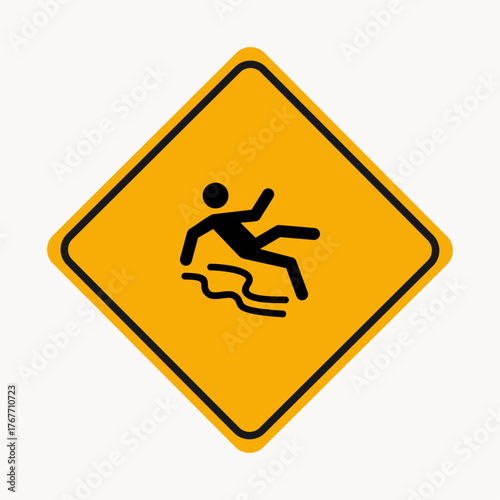 A yellow sign warns of a slippery floor, depicting a person falling it serves as a crucial safety measure to prevent accidents and injuries