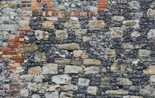 Mixed brick and stone wall background texture