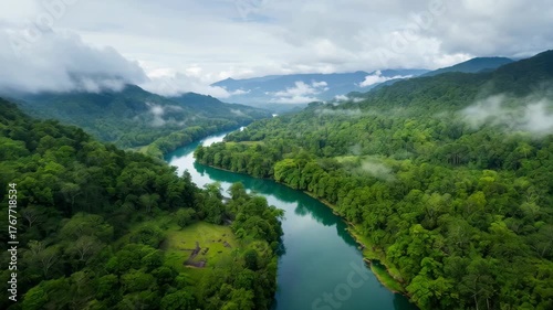 Misty Mountain River Valley With Lush Green Forest And Overcast Sky Aerial Drone View
