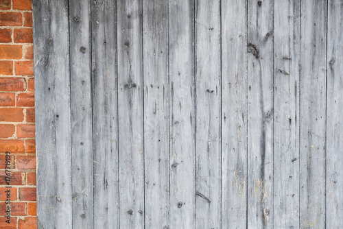 Wooden planks on brick wall background texture