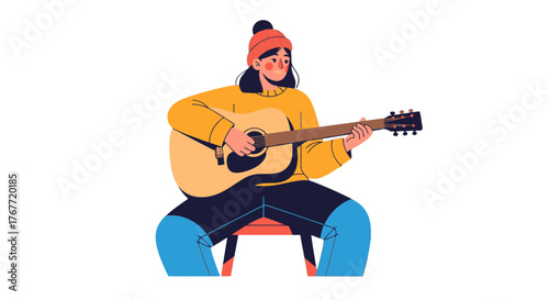 A Person Plays Acoustic Guitar, Enjoying Music and Creative Expression in This Image