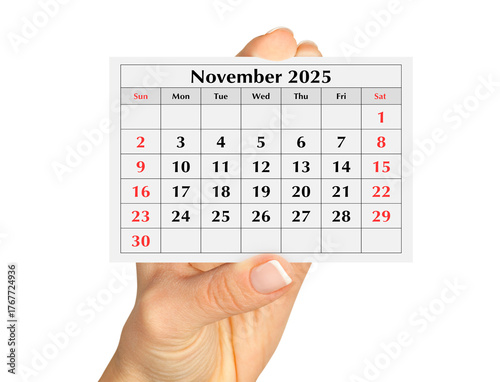 Page of the annual monthly calendar november 2025 in hand. Isolated on transparent png