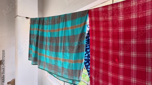 Indoor Clothes Drying on Curtain Rod by Balcony 