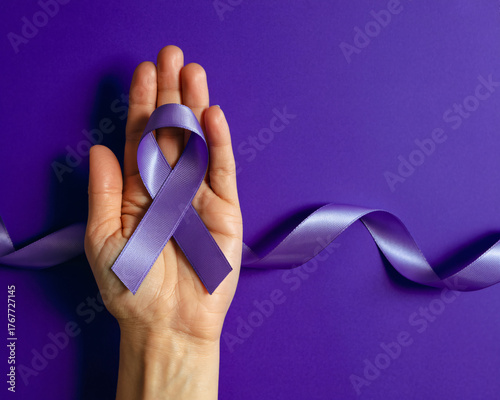 Hopeful hand cradles purple awareness ribbon symbolizing support and unity against disease on vibrant background