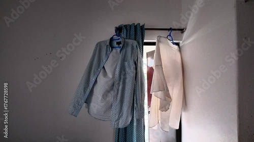 Indoor Clothes Drying on Curtain Rod by Window