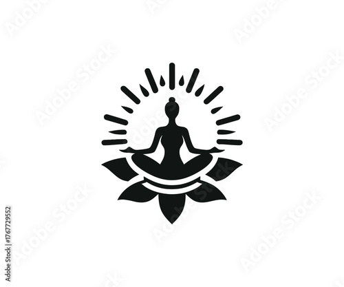 Silhouette of woman meditating on a lotus flower