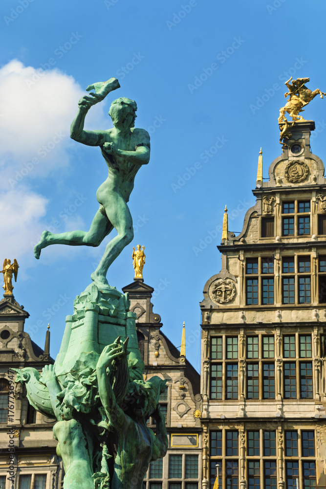 Fototapeta premium statue of Silvius Brabo, a legendary Roman soldier and building are located in the historic Grote Markt, the central square of Antwerp, surrounded by guild houses and major landmarks. 