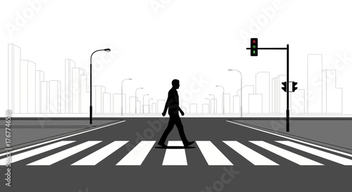 A Person Walks Across A Crosswalk in Front Of City Buildings With Traffic Lights
