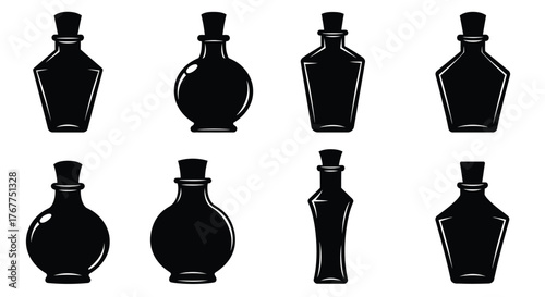 A collection of vintage style black bottles with cork stoppers shown