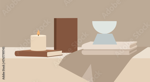 Minimalist still life with candle books and geometric sculpture in neutral tones