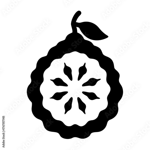 Black silhouette of a sliced citrus fruit with a leaf on a