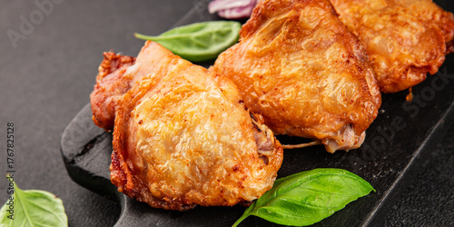 Chicken thighs fried poultry meat dish natural product tasty snack fresh delicious gourmet food background on the table rustic top view copy space