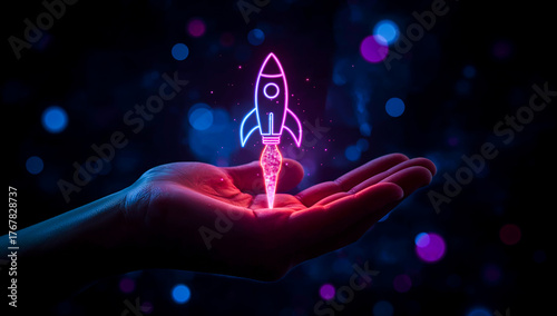 Close-up of cupped hand presenting glowing neon rocket hologram with pink and blue light, representing startup growth, innovation, idea launch, and futuristic digital technology with copy space