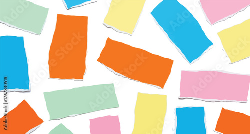 Brightly colored torn paper pieces scattered on a white background for creative collage and craft projects