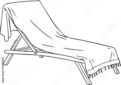 A simple beach chair with a towel draped over it, perfect for relaxation by the water.