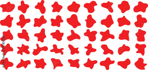 Abstract red organic shapes scattered on a textured white background