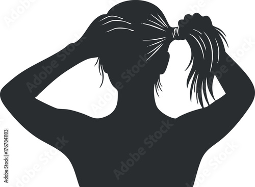 Silhouette of a woman styling her hair in a ponytail from a back view