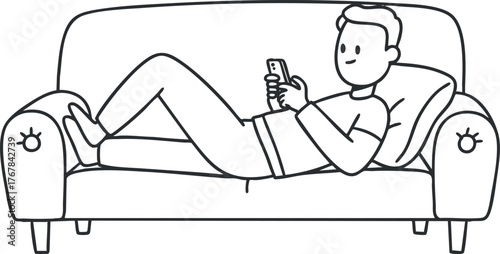 A young man relaxing on a couch while using a smartphone, depicting leisure and comfort.