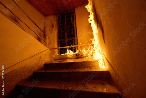 Canvas Print Staircase engulfed in flames, fire hazard in building, dangerous situation, burning staircase, fire accident, emergency, risk of conflagration, fire safety concept, danger, destruction