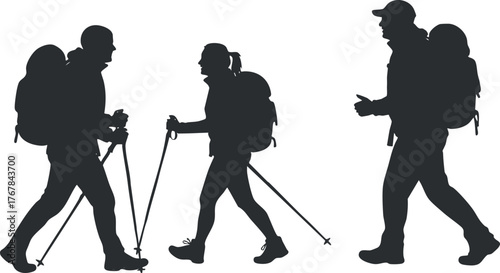 Silhouettes of hikers enjoying an outdoor adventure with trekking poles in nature.