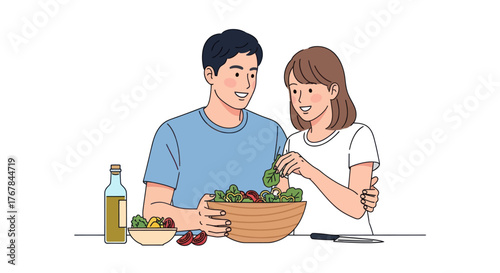 A happy young Asian couple preparing a fresh vegetable salad together in the kitchen.
