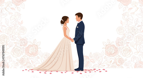A bride and groom stand holding hands in front of a rosy floral background, looking at each other on their wedding day.