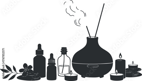 A serene arrangement of essential oils, candles, and a diffuser for relaxation and wellness.