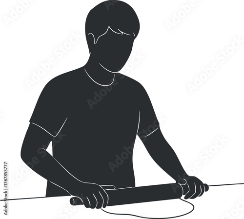 A person using a rolling pin to prepare dough in a kitchen setting.