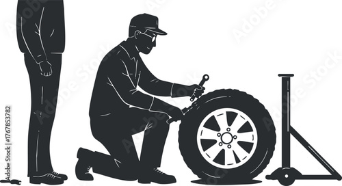 A mechanic changing a tire on a vehicle with a jack and tools in a workshop setting