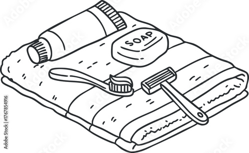 A collection of toiletries including a towel, soap, toothbrush, and toothpaste arranged for hygiene.