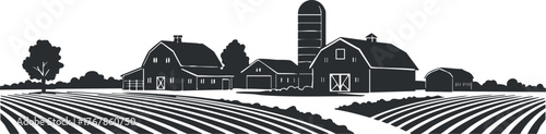 A serene silhouette of a traditional farm with barns and crops in a rural landscape.
