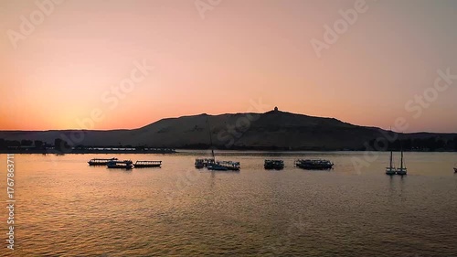 The Nile at Aswan and the West Bank with Tombs of the Nobles (from the Old and Middle Kingdom). There is Qubbet el-Hawa - 'Dome of the Winds' (tomb of a Muslim prophet) at the crest of the hill