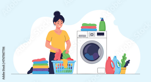 Young woman folding clean laundry next to a washing machine and detergent bottle.