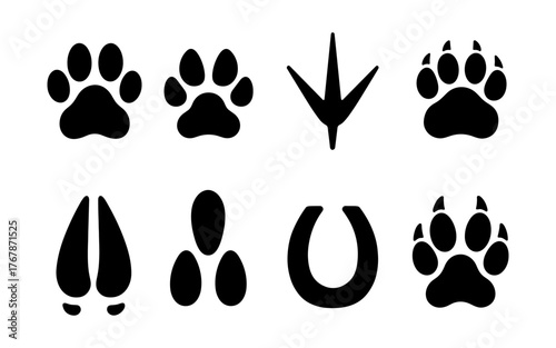 Silhouette set of animal tracks including dog paw, cat paw, bird footprint, bear track, deer hoof, horse shoe, and wild animal prints.