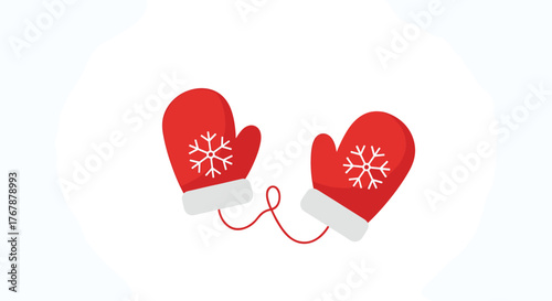 A pair of red winter mittens with snowflakes connected by a string for cold weather.
