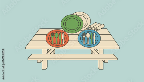A set of colorful camping plates and utensils made from biodegradable materials arranged on a picnic table ready for a meal.
