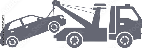 Tow truck lifting a car with a crane vehicle