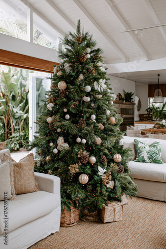 Festive Christmas tree decorated with ornaments in a cozy living room setting
