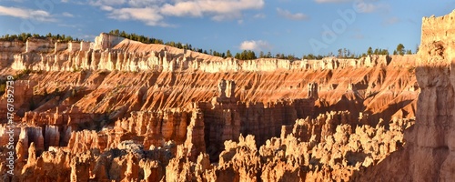 Stone hoodoos at sunrise in the amphitheater of Bryce Canyon National Park in Utah.