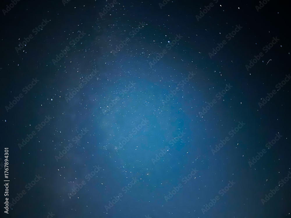Obraz premium Stunning Starry Night Sky over Dark Landscape