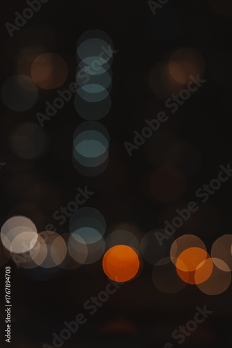 Abstract bokeh lights in the dark, creating a dreamy and artistic background. This image captures the beauty of blurred lights, perfect for adding a touch of elegance to any project. Night city lights