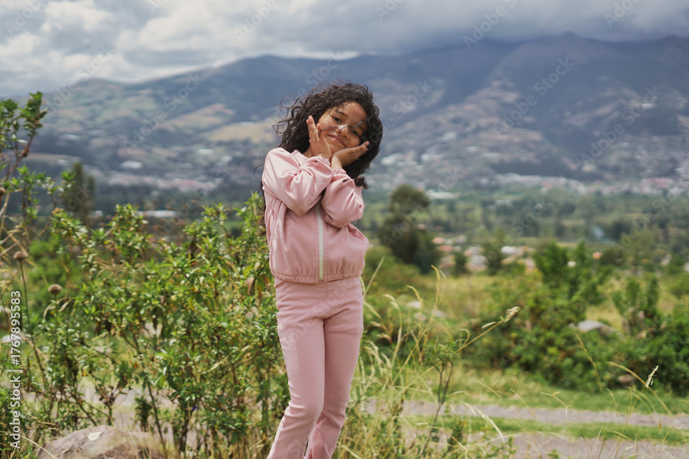 Naklejka premium Young girl smiling showing innocence in nature. Children's Week