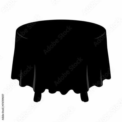 A circular table with a long black tablecloth draped over it