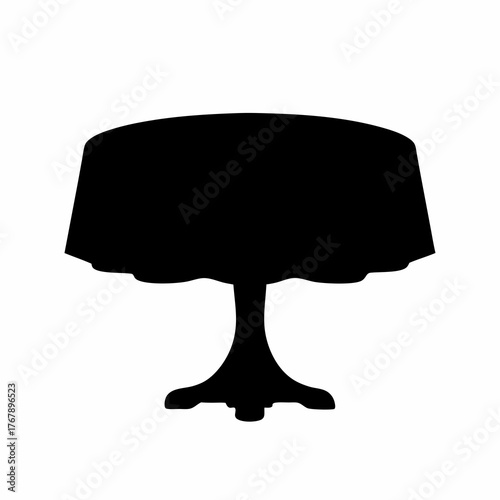 Elegant round table with a flowing tablecloth silhouette against white background