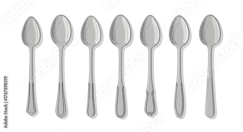 Set of eight silver teaspoons arranged in a row.