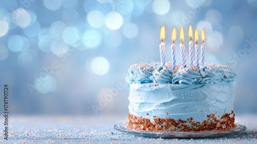 Blue Birthday Cake With Lit Candles Surrounded by Festive Decorations and Shimmering Background
