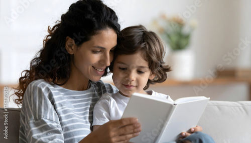 Reading Time: A tender moment of bonding between a mother and child as they share a book. Capturing the intimacy of family time, the image radiates warmth and love.